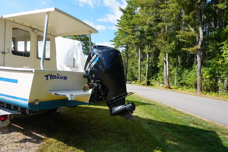 Slide: The Image of 2002 Rosborough RF-246 Sedan Cruiser with Mercury outboard motor on trailer. - 2