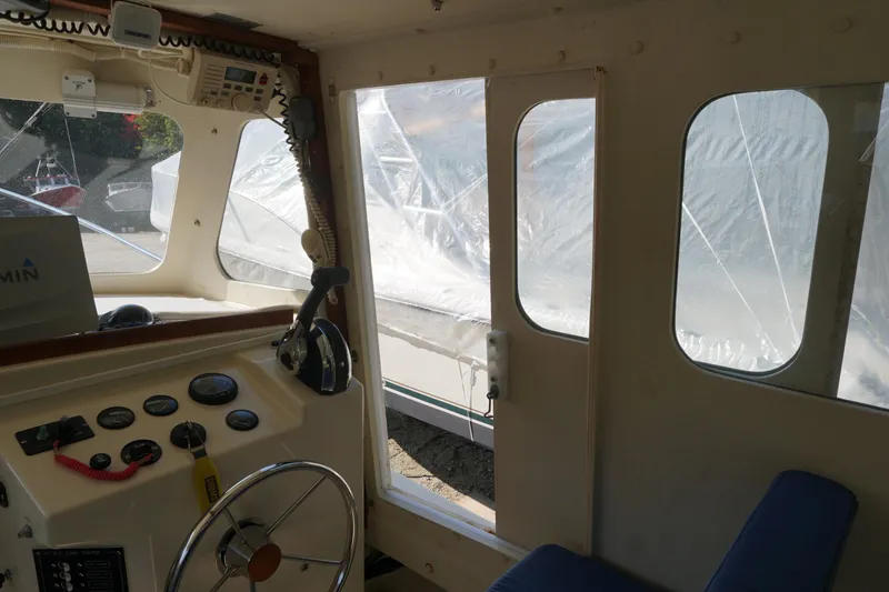 Slide: The Image of Interior view of 2002 Rosborough RF-246 Sedan Cruiser with steering wheel and control panel. - 23