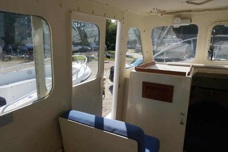 Slide: The Image of Interior view of 2002 Rosborough RF-246 Sedan Cruiser with open door and seating. - 27