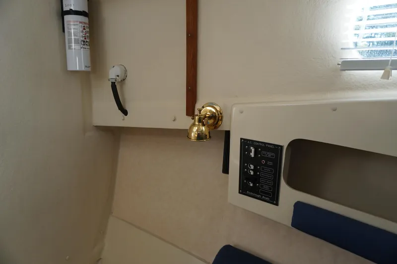 Slide: The Image of 2002 Rosborough RF-246 Sedan Cruiser interior with control panel and fire extinguisher. - 29