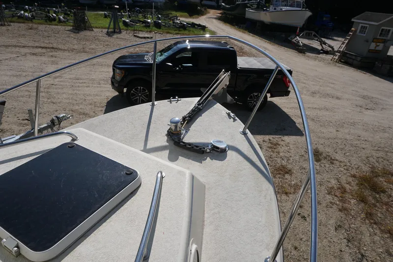 Slide: The Image of Bow view of 2002 Rosborough RF-246 Sedan Cruiser with truck in background. - 39