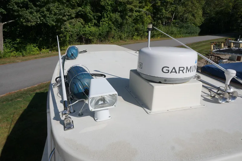 Slide: The Image of 2002 Rosborough RF-246 Sedan Cruiser with Garmin radar and spotlight on deck. - 40