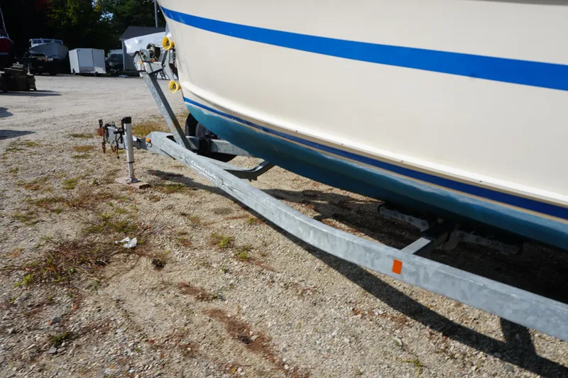 Slide: The Image of 2002 Rosborough RF-246 Sedan Cruiser on a trailer, parked on gravel. - 9