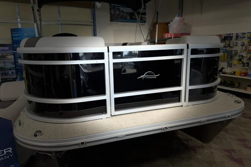 Slide: The Image of 2025 SunCatcher Select 16C pontoon boat displayed indoors, showcasing sleek design and modern features. - 9