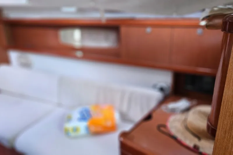 Slide: The Image of Interior of 2010 Beneteau Oceanis 34 GT yacht with wooden cabinetry and seating. - 21