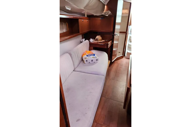 Slide: The Image of Interior of 2010 Beneteau Oceanis 34 GT yacht with wooden table and seating. - 28