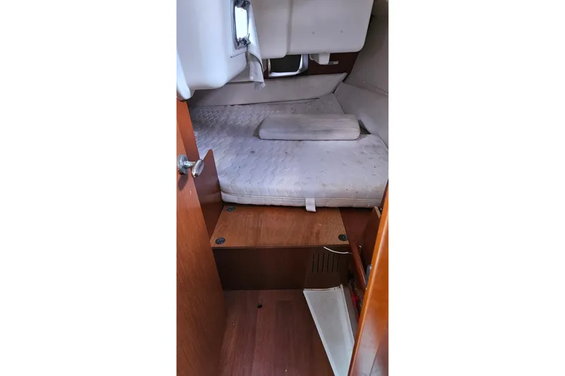 Slide: The Image of Cozy interior of 2010 Beneteau Oceanis 34 GT sailboat with wooden furnishings and seating. - 30