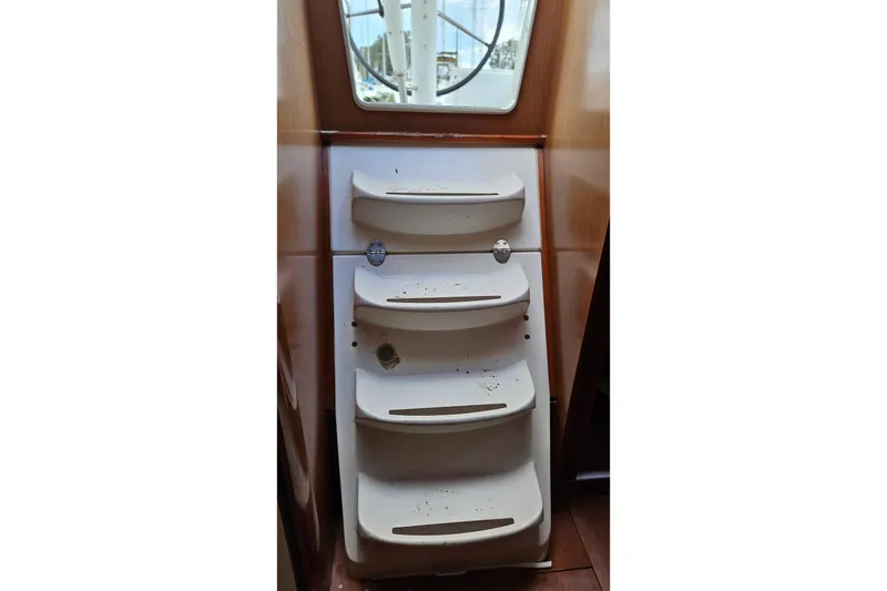 Slide: The Image of Cabin interior of 2010 Beneteau Oceanis 34 GT with wooden finish and mattress. - 31