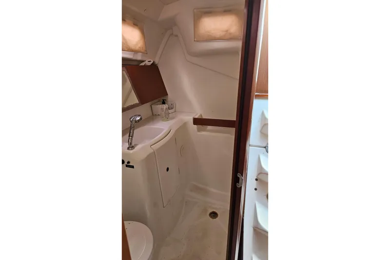 Slide: The Image of Staircase inside 2010 Beneteau Oceanis 34 GT yacht, leading to deck. - 32