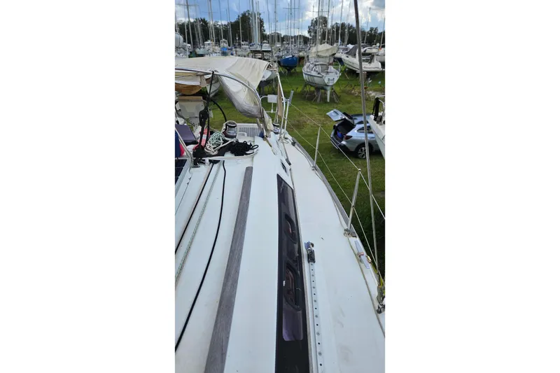 Slide: The Image of Solar panel on 2010 Beneteau Oceanis 34 GT sailboat deck, with ropes and equipment. - 34