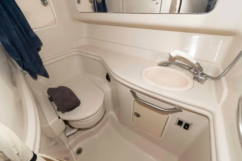 Slide: The Image of Luxurious 2006 Sea Ray 320 Sundancer cabin interior with cozy seating and elegant decor. - 16