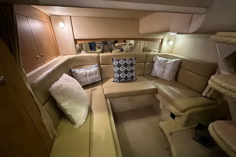 Slide: The Image of Interior of 2006 Sea Ray 320 Sundancer with cozy seating and decorative pillows. - 27