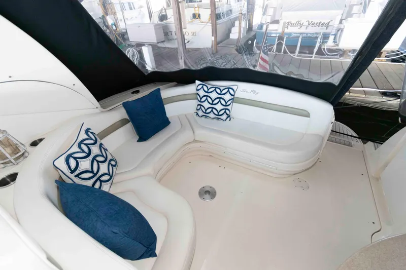 Slide: The Image of 2006 Sea Ray 320 Sundancer interior with helm, seating, and modern amenities. - 3