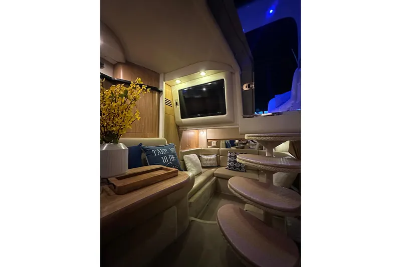 Slide: The Image of Luxurious interior of 2006 Sea Ray 320 Sundancer yacht with cozy seating and elegant decor. - 30