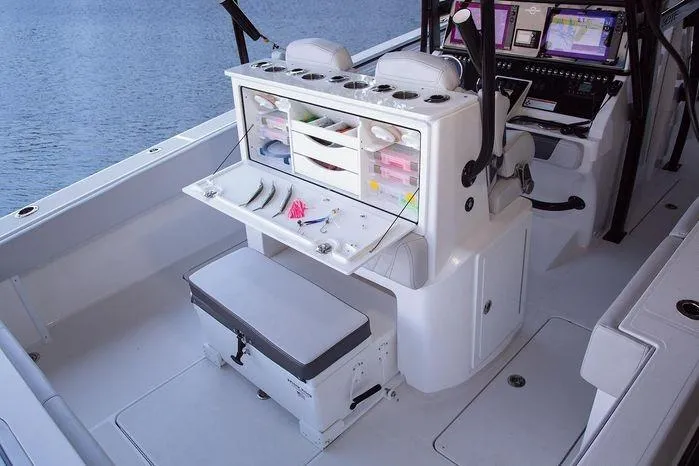 Slide: The Image of 2024 Fountain Bluewater 38 Tournament Edition boat interior with fishing gear and navigation equipment. - 14