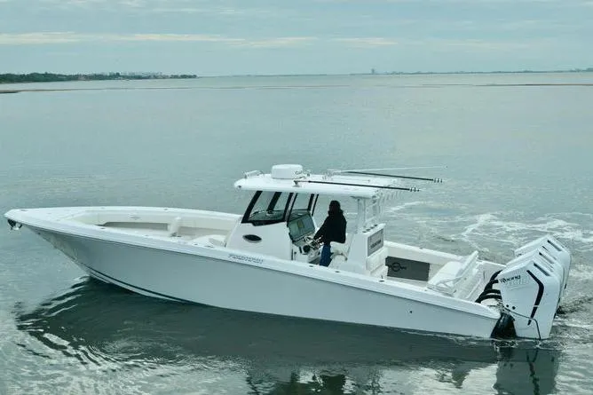 Slide: The Image of 2024 Fountain Bluewater 38 Tournament Edition boat cruising on calm waters. - 4