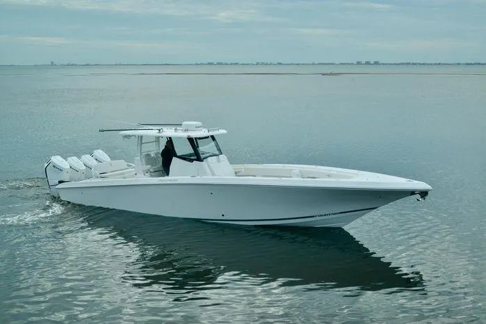 Slide: The Image of 2024 Fountain Bluewater 38 Tournament Edition boat cruising on calm waters. - 5