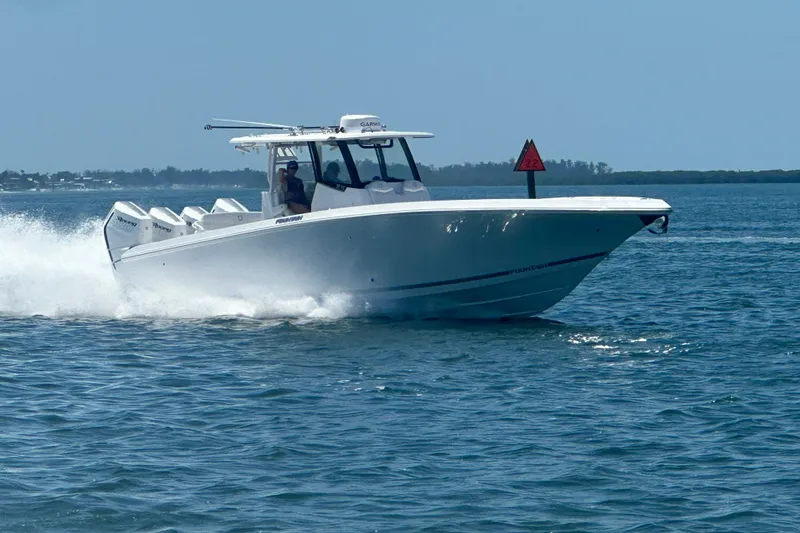 Slide: The Image of 2024 Fountain Bluewater 38 Tournament Edition speeding on open water. - 6