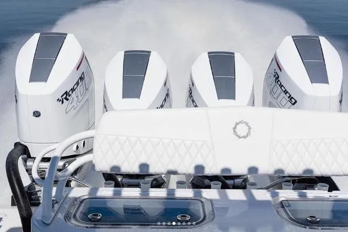 Slide: The Image of 2024 Fountain Bluewater 38 Tournament Edition with four powerful outboard engines on the water. - 7