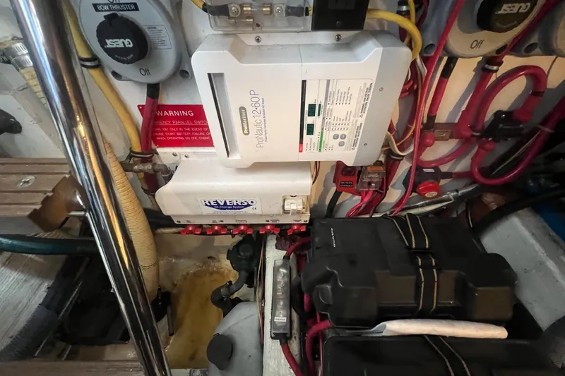 Slide: The Image of Engine room of a 2004 Sabre 36 Hardtop Sedan with electrical components and wiring. - 19