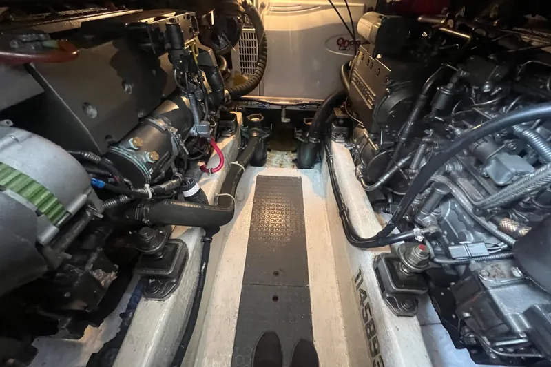 Slide: The Image of Engine room of a 2004 Sabre 36 Hardtop Sedan, showcasing dual engines and mechanical components. - 20
