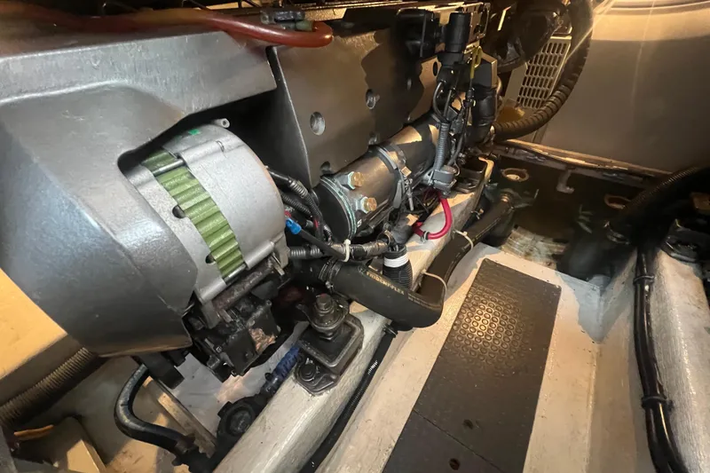 Slide: The Image of Engine compartment of a 2004 Sabre 36 Hardtop Sedan boat, showcasing mechanical components. - 21