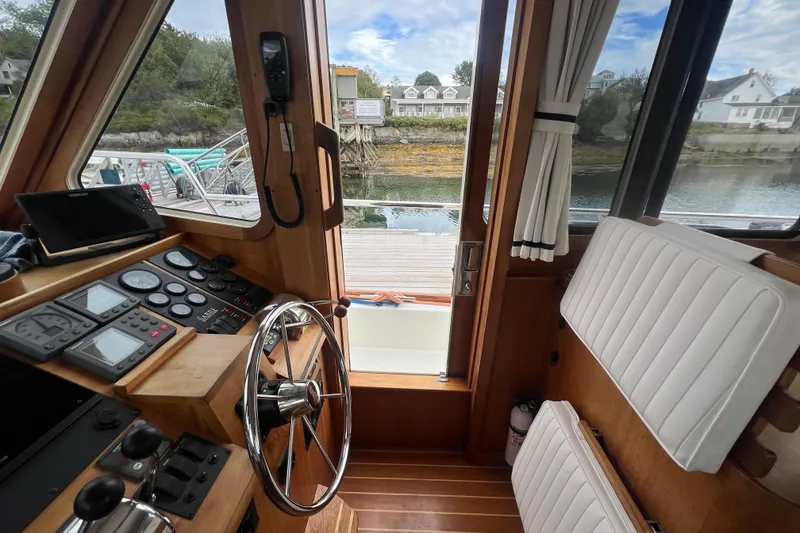 Slide: The Image of Interior view of 2004 Sabre 36 Hardtop Sedan boat with steering wheel and control panel. - 7