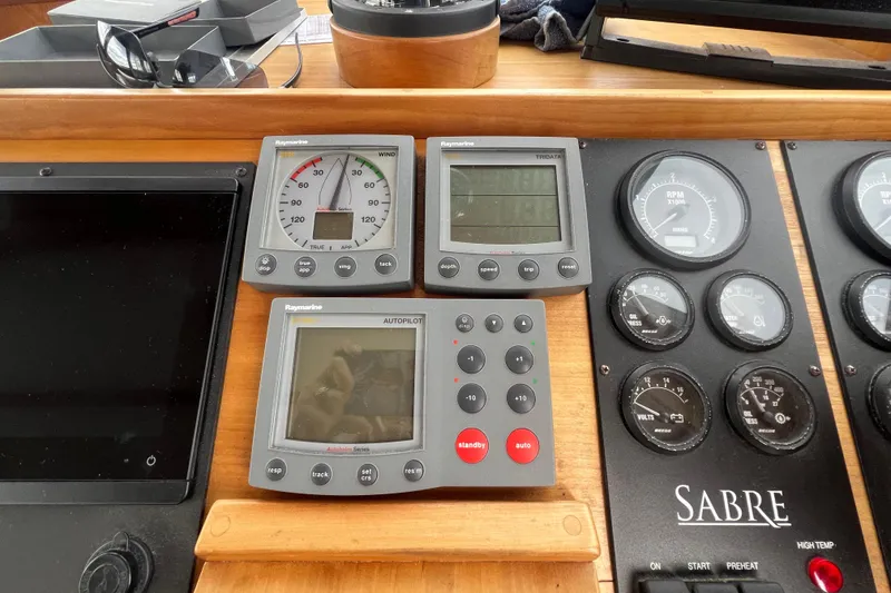 Slide: The Image of Control panel of a 2004 Sabre 36 Hardtop Sedan with Raymarine instruments. - 9