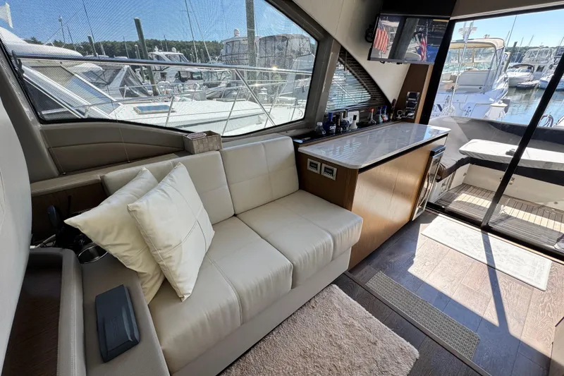 Slide: The Image of 2017 Sea Ray Sundancer 460 yacht docked at marina, rear view. - 23