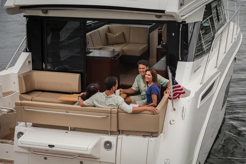 Slide: The Image of Interior of 2017 Sea Ray Sundancer 460 yacht with modern kitchen and seating area. - 6