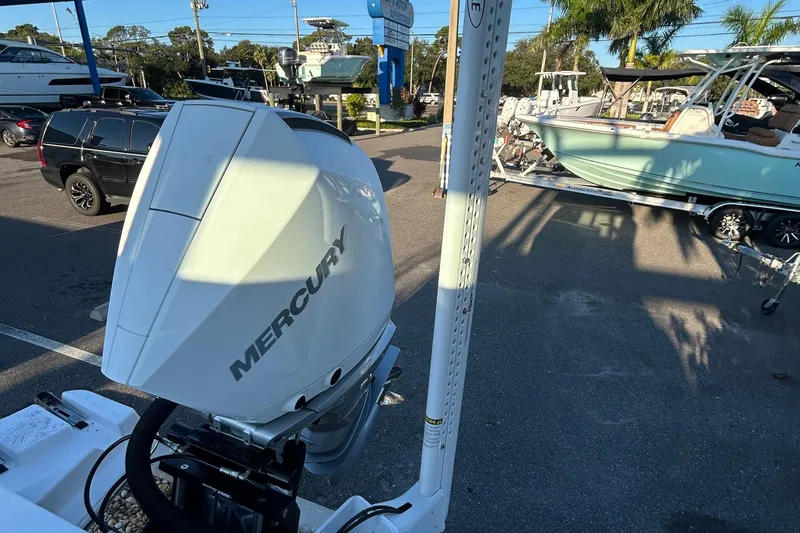 Slide: The Image of 2026 Blackfin 242 HB with Mercury engine in a sunny marina setting. - 15