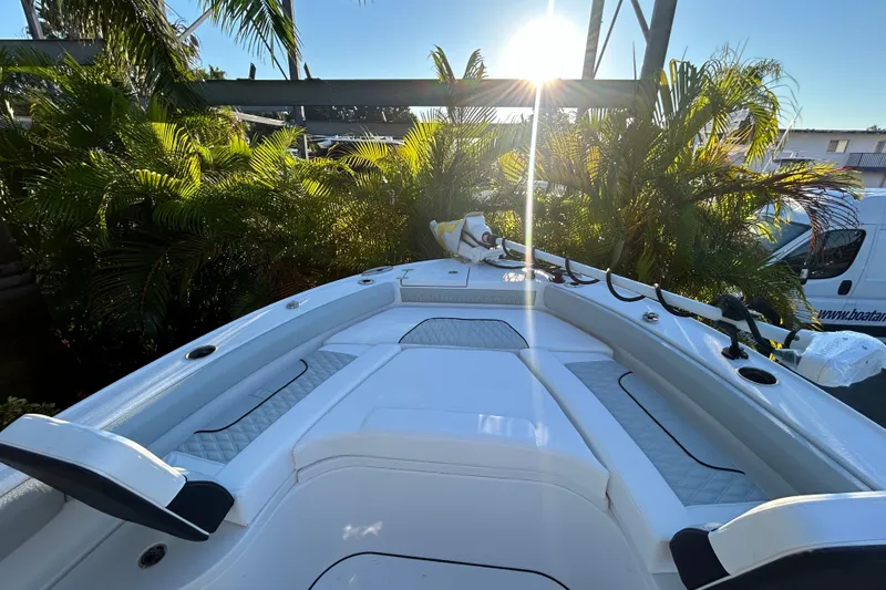 Slide: The Image of 2026 Blackfin 242 HB boat deck with sunlit tropical backdrop. - 6