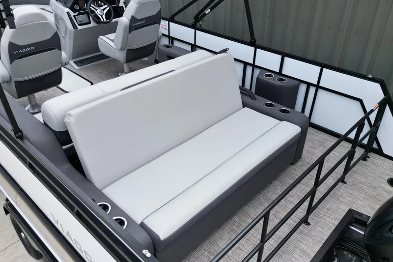 Slide: The Image of 2026 Viaggio Lago X-S boat interior with gray seating and modern dashboard design. - 13
