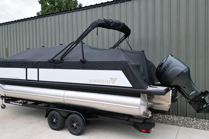 Slide: The Image of 2026 Viaggio Lago X-S pontoon boat with Suzuki outboard motor, covered and on trailer. - 20