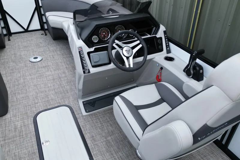 Slide: The Image of 2026 Viaggio Lago X-S boat interior with modern steering console and comfortable seating. - 9