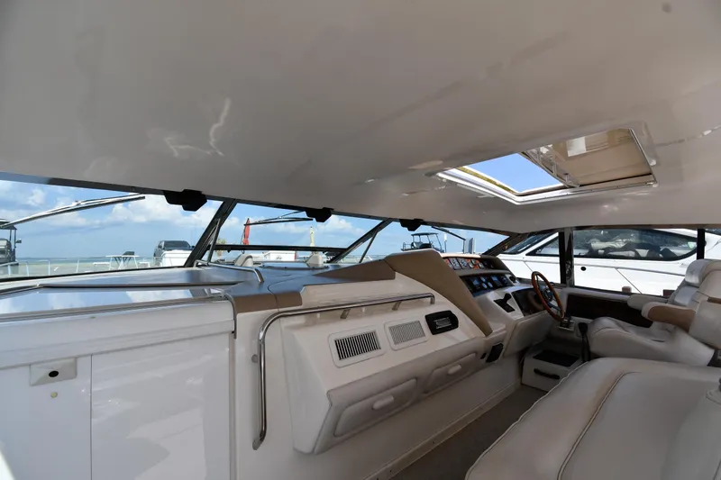 Slide: The Image of Interior view of 1995 Sea Ray 630 Sundancer yacht cockpit with modern controls. - 10