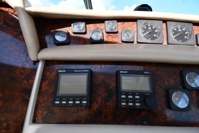 Slide: The Image of Control panel of a 1995 Sea Ray 630 Sundancer with gauges and navigation displays. - 15