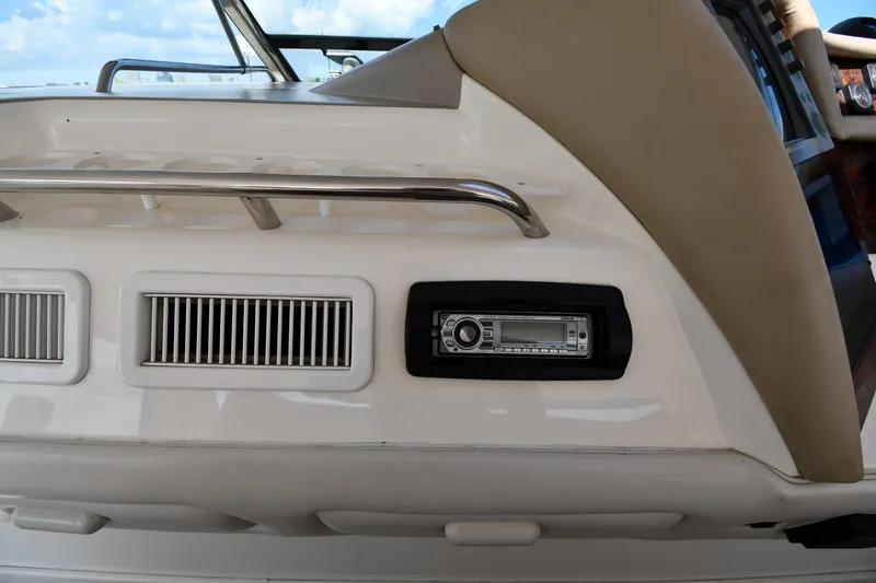 Slide: The Image of 1995 Sea Ray 630 Sundancer boat interior with stereo system and ventilation grilles. - 20