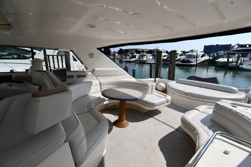 Slide: The Image of Luxurious 1995 Sea Ray 630 Sundancer yacht interior with plush seating and marina view. - 24