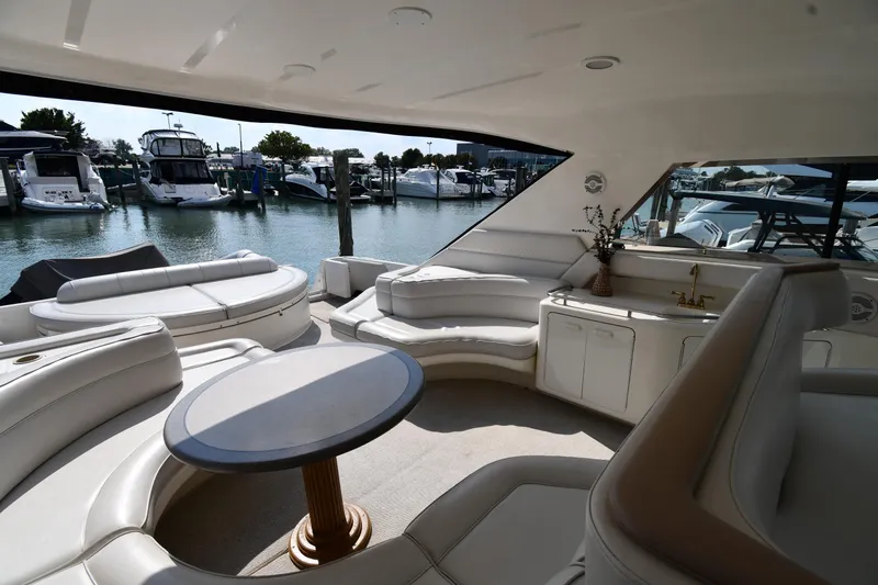 Slide: The Image of Luxurious interior of 1995 Sea Ray 630 Sundancer yacht docked at marina. - 25