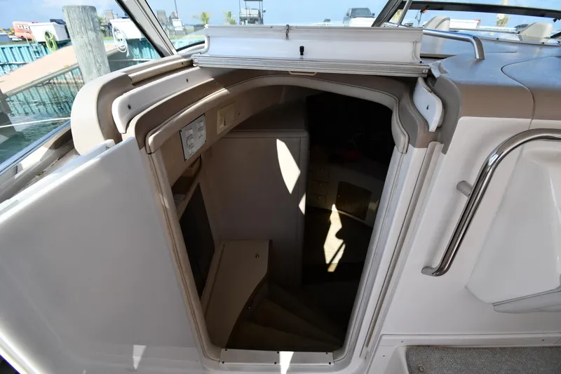 Slide: The Image of Entrance to cabin of 1995 Sea Ray 630 Sundancer yacht, featuring stairs and interior view. - 39