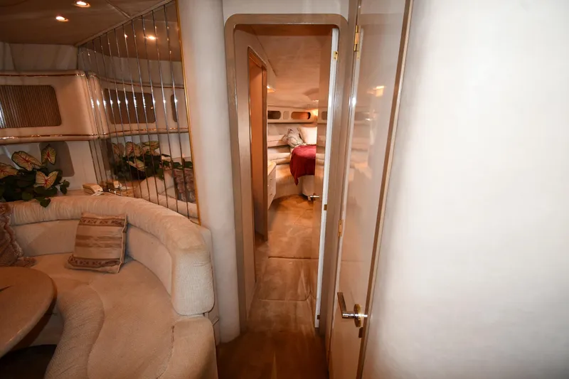 Slide: The Image of Luxurious interior of a 1995 Sea Ray 630 Sundancer yacht, featuring elegant seating and decor. - 40