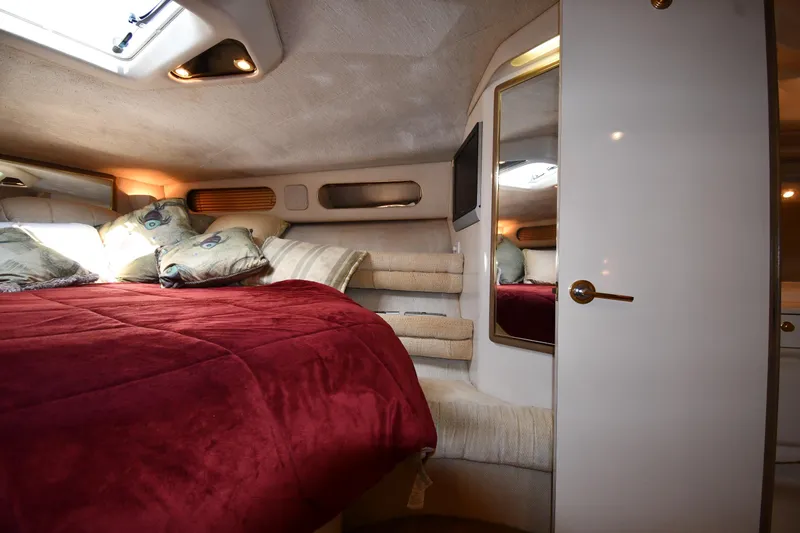 Slide: The Image of Luxurious cabin interior of 1995 Sea Ray 630 Sundancer yacht with cozy bedding. - 42