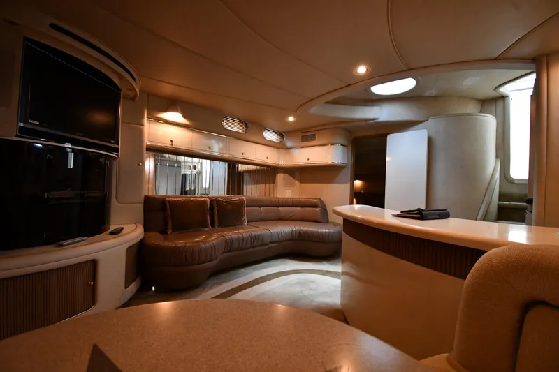 Slide: The Image of Luxurious interior of a 1995 Sea Ray 630 Sundancer yacht with plush seating and modern amenities. - 53