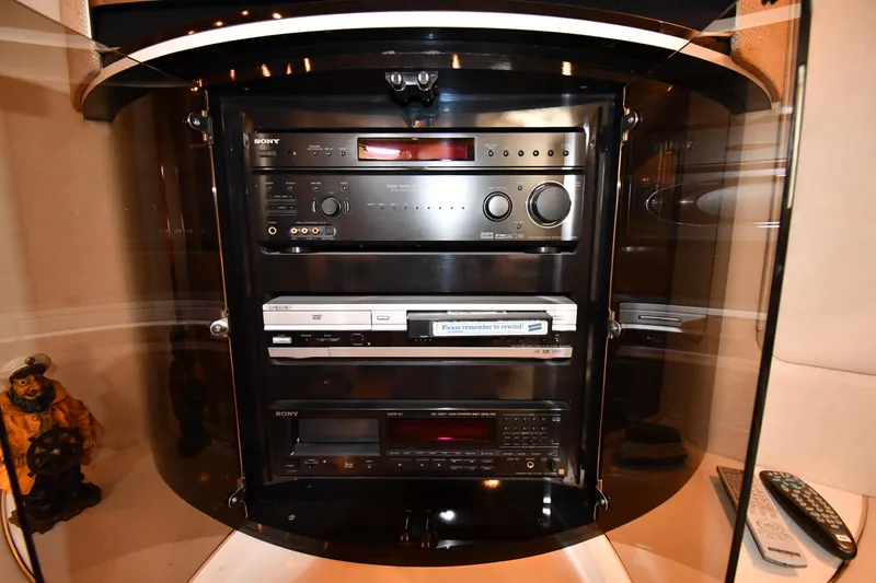 Slide: The Image of Entertainment system inside 1995 Sea Ray 630 Sundancer yacht, featuring Sony audio and video equipment. - 61