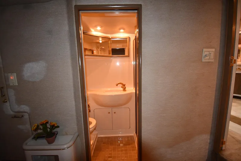 Slide: The Image of 1995 Sea Ray 630 Sundancer bathroom interior with sink and mirror. - 67