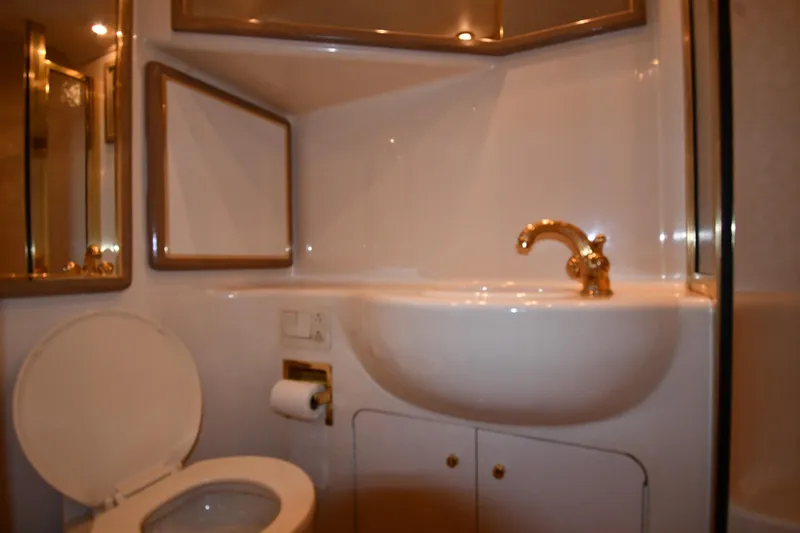 Slide: The Image of Luxurious bathroom in 1995 Sea Ray 630 Sundancer yacht with gold fixtures. - 70