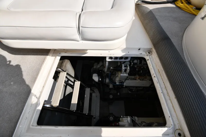 Slide: The Image of Engine compartment of 1995 Sea Ray 630 Sundancer with open hatch and visible ladder. - 72