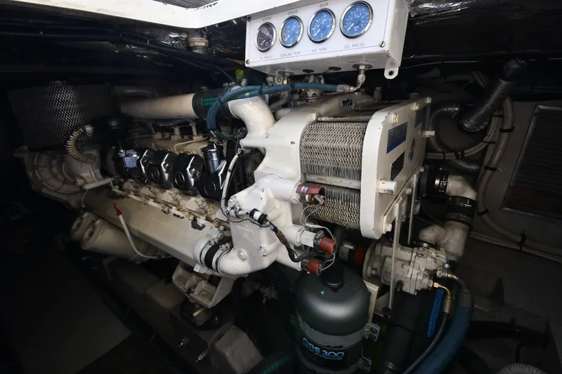 Slide: The Image of Engine room of a 1995 Sea Ray 630 Sundancer with visible gauges and components. - 73