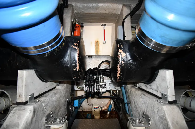 Slide: The Image of Engine room of a 1995 Sea Ray 630 Sundancer with visible pipes and equipment. - 83